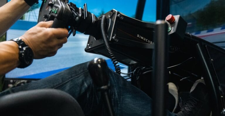 Racing simulator direct-drive wheelbase with carbon fiber steering wheel and professional button controls