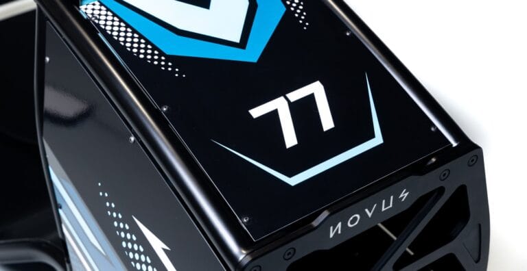 Novus racing simulator side panel featuring number 77 and custom branding graphic design