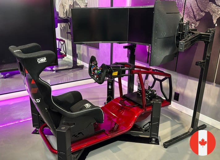 Novus racing simulator with red X Cage chassis and triple curved monitors at Canadian demo location