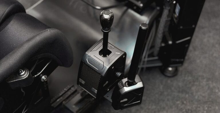 Sequential gear shifter and handbrake mounted on racing simulator with carbon fiber steering wheel