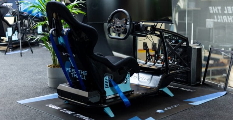 X Cage modular racing simulator chassis with adjustable wheelbase mount and pedal platform in aluminum construction