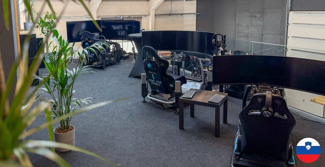 Indoor showroom at Novus factory in Žiri, Slovenia with multiple racing simulator rigs including Misha Spec, Strike, and Edge systems available for testing